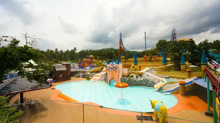 Families enjoying water rides and slides in Dream World Kerala